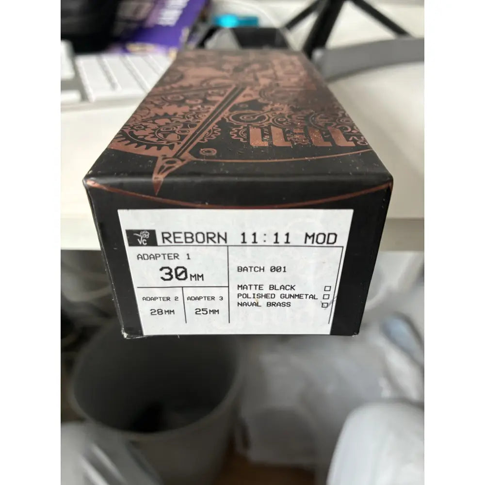 Original Reborn 11:11 packaging label showing Batch 001 and adapter sizes
