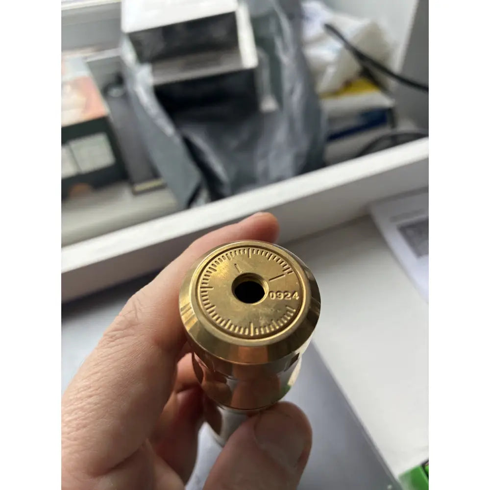 Close-up of the Reborn 11:11 brass base cap marking 0924